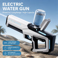 Electric water gun with automatic water feeding, front view on a beach